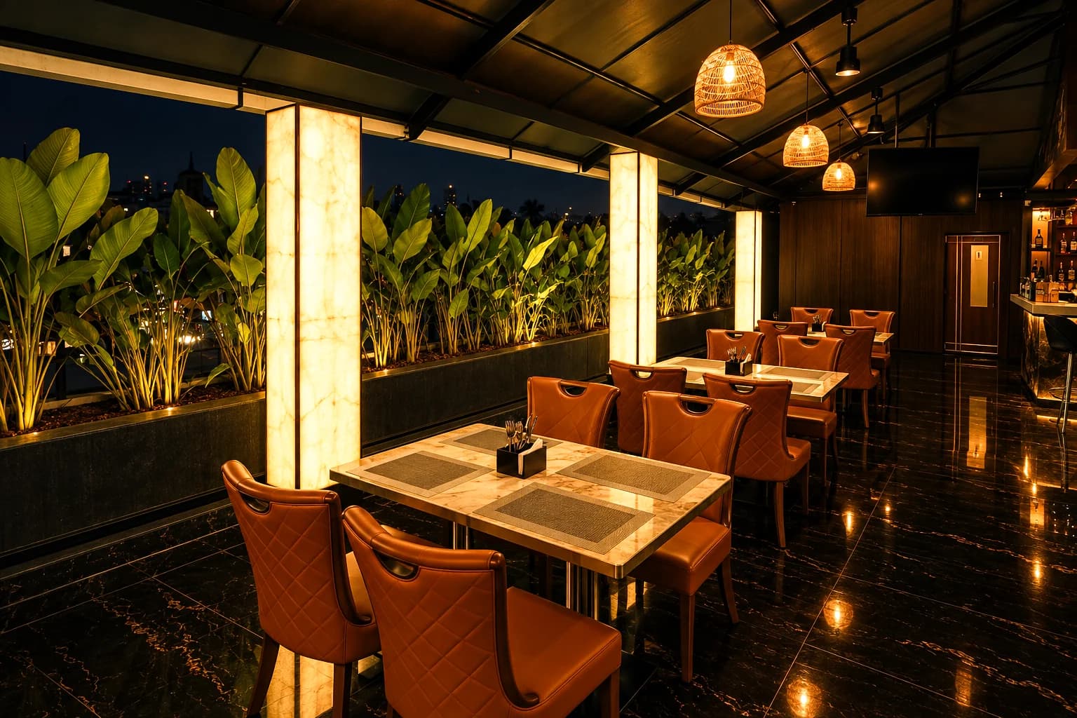 Glowing onyx columns and planters along the edge of the rooftop