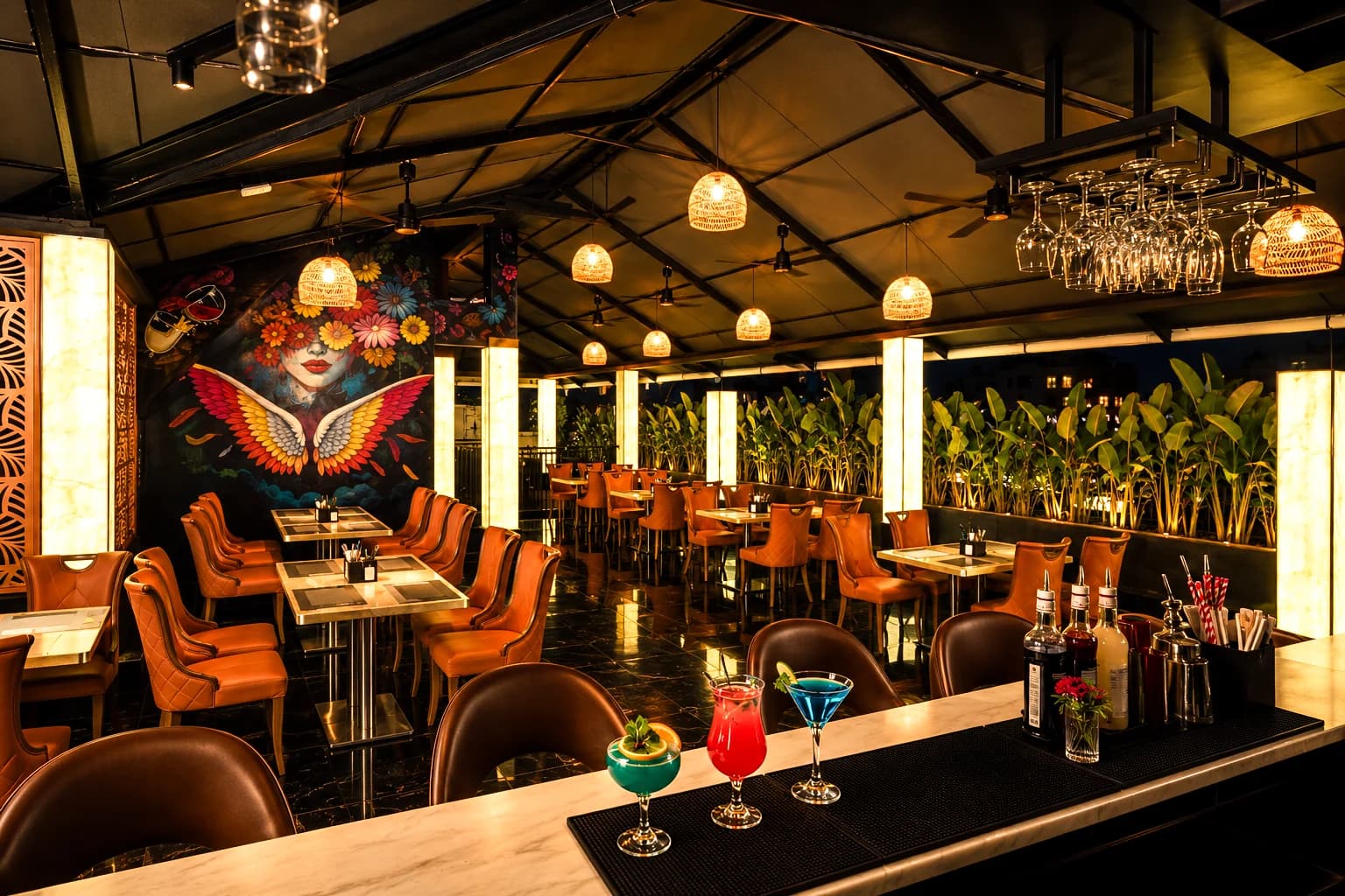Cocktails on the CasaBay bar with the winged mural behind