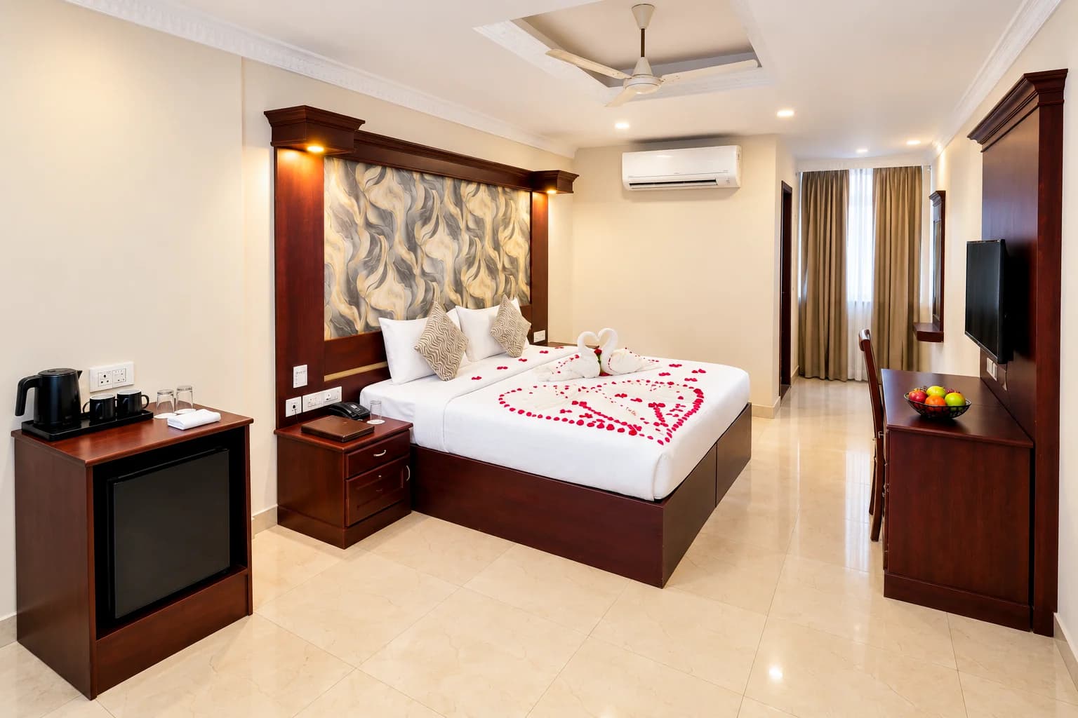 Guest room with kettle station, desk and television