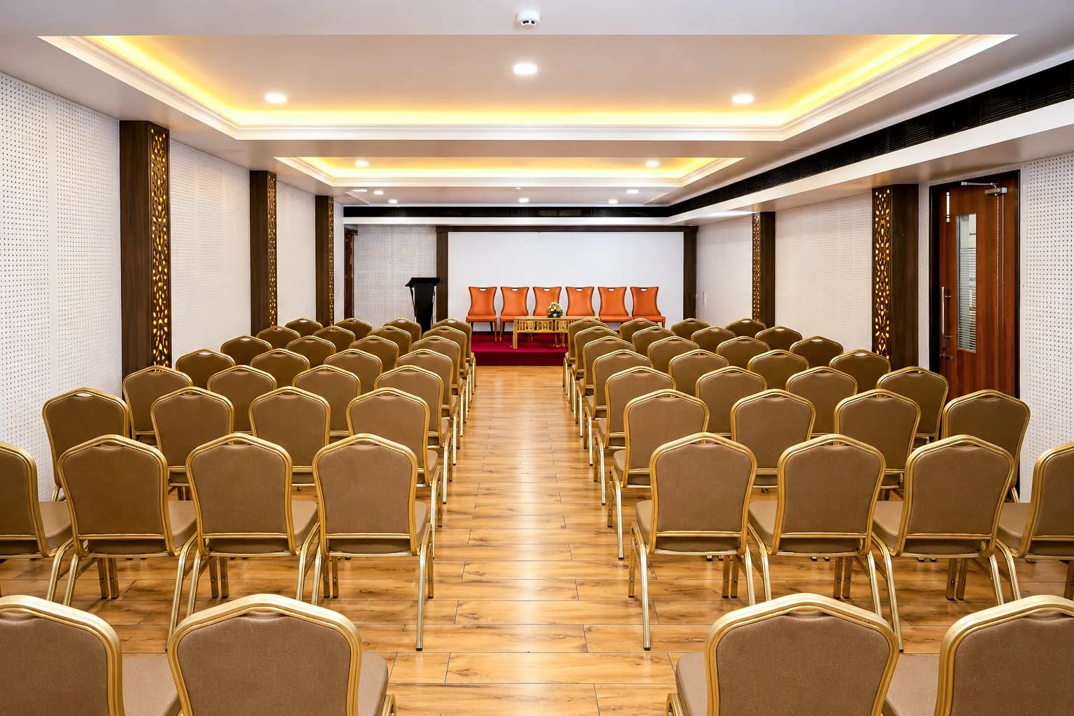 Rows of banquet chairs in Town Hall