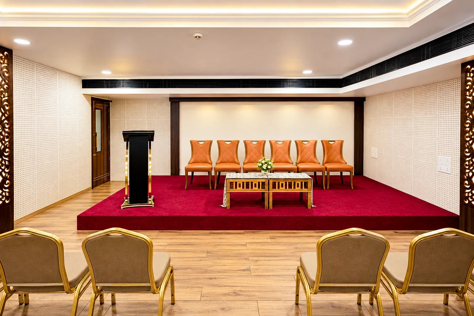 Town Hall stage with podium and head-table chairs